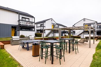 Spacious patio with sitting arrangements with bbq
